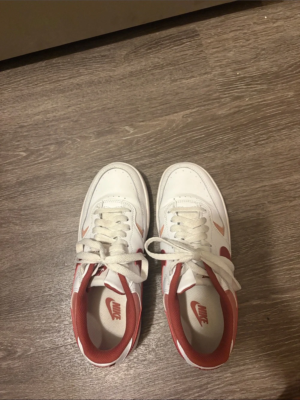 Women’s Nike White Sneakers with Red Swoosh